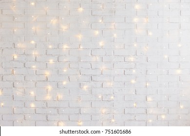 White Brick Wall Christmas Background With Shiny Lights
