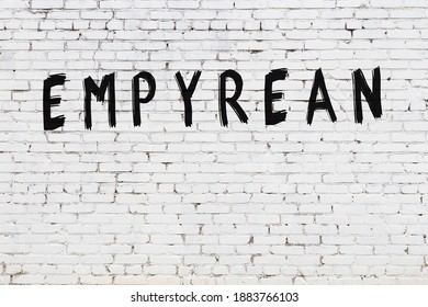 White brick wall with inscription empyrean handwritten with black paint - Shutterstock ID 1883766103