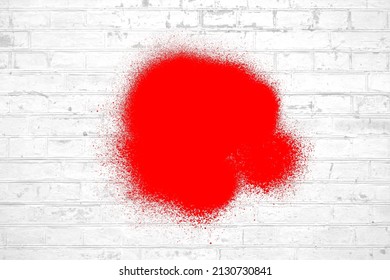 White Brick Wall With Red Graffiti Spray