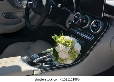 White Bridal Bouquet Inside A Luxury Car