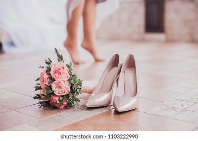 White bride shoes and bouquet