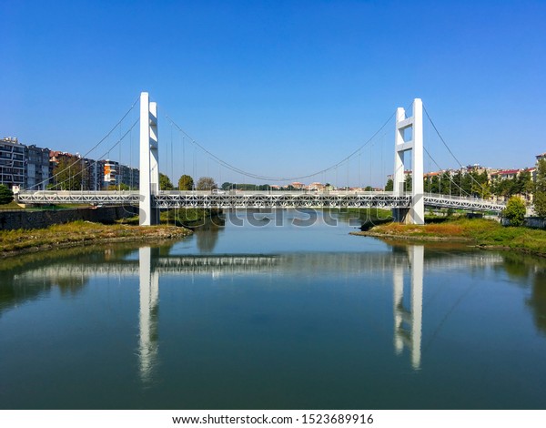 The white bridge in district of\
Carsamba, in city of Samsun, Turkey is looking like Bogazici Bridge\
in Istanbul. Nice reflection of bridge over Yesilirmak\
River.