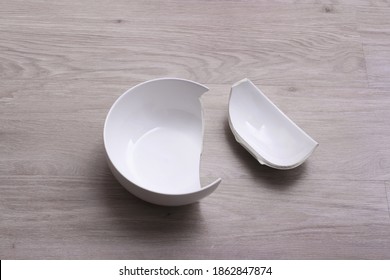 A White Broken Bowl On The Floor