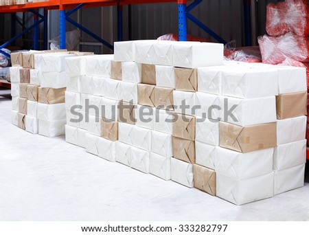 white and brown box paper stacking in warehouse