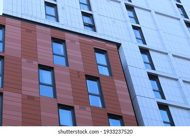 White and brown cladding covering student flats. White and brown cladding in England.