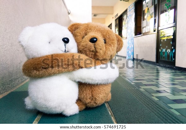 hugging teddy bears