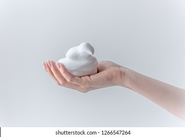 white bubbled foam in hands, hair foam, foam for man, white textured, hand full of soap isolated on white background