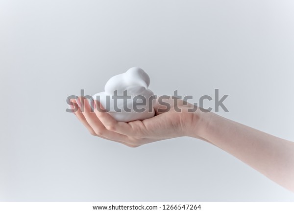 white\
bubbled foam in hands, hair foam, foam for man, white textured,\
hand full of soap isolated on white\
background