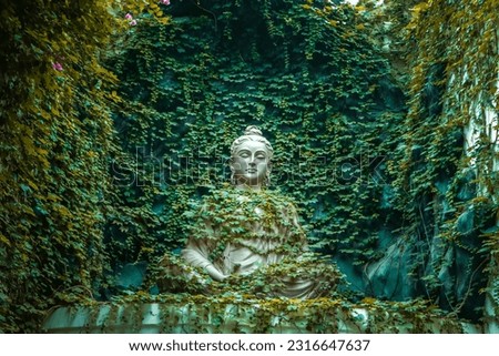White buddha Statue with Beautiful green background in Rishikesh. Uttarakhand. India. Asia