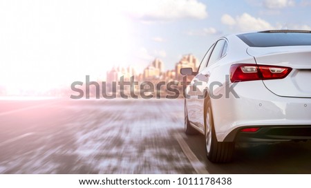 white business car moving on highway