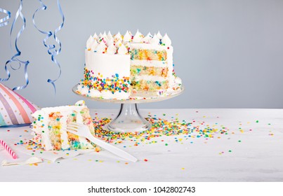 White buttercream confetti Birthday cake with colorful sprinkles
