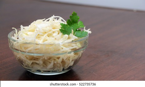 White Cabbage Salad In Glass Bowl On A Wooden Table