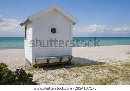 White cabin in a beach