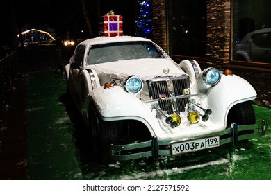 White Cadillac Covered With Snow. Moscow. 12.12.2021