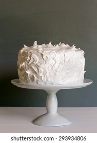 White Cake On Stand With Gray Background, Vertical