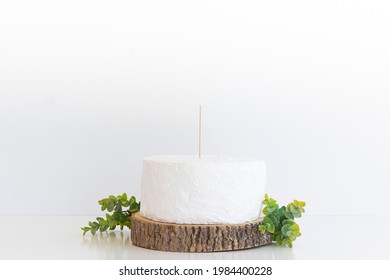 White Cake With Cake Topper Stick And Blank White Background On  Space On Wood Slice With Green
Eucalyptus , Cake Topper Mock Up