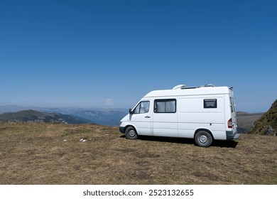 White camper van parked on top of the mountain with a great view over the valleys in Biogradska National Park, Montenegro - Powered by Shutterstock