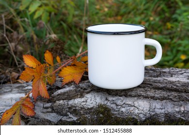 White Campfire Enamel Coffee Mug Mockup With Fall Orange Leaf.  Empty Mug Mock Up For Design Promotion. 