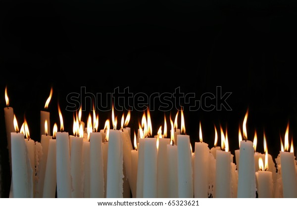 White Candle Flames On Black Background Stock Photo (Edit Now) 65323621