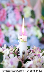White Candle with flower decor on floral background