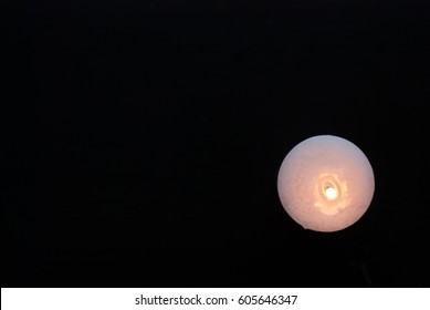 White Candle On A Black Background, A Small Flame Of Candle, Top View