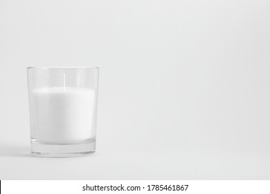 White Candle In Transparent Glass On White Background, Mock Up