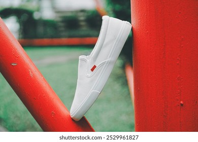 White canvas sneakers slip on men's footwear fashion shot outdoor. - Powered by Shutterstock