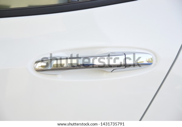 white car door handle\
abstract background