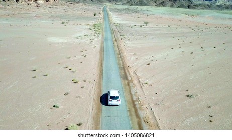 White Car On An Old Desert Road, Aerial Image.