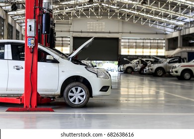 White Car Repair Station With Soft-focus In The Background And Over Light