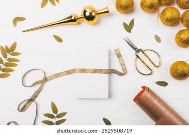 A white card with a gold ribbon is sitting on a table with scissors - Powered by Shutterstock