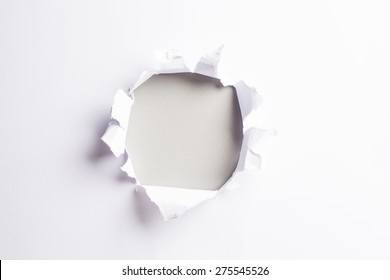 White card with hold punched through - colorful light grey background