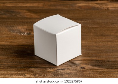 White Cardboard Box On Wooden Background, Moke Up