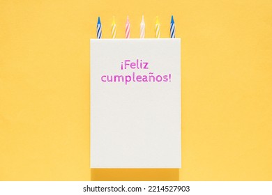 White Cardboard Vertical Poster With Cake Candles On Top On A Bright Yellow Background. The Inscription 