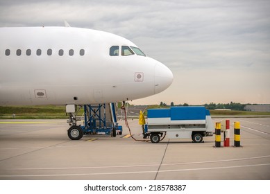 White Cargo Plane At Airport Refueling Station