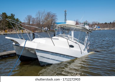 White Catamaran Boat Sinking In Boat Slip