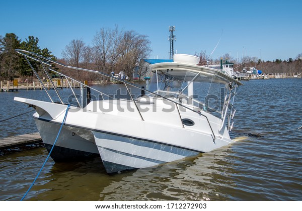 white catamaran boat
sinking in boat slip