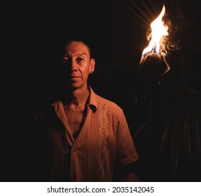 White Caucasian Man White Light Shirt Holding A Torch In The Dark In Coba, Quintana Roo, Mexico On September 12th 2020