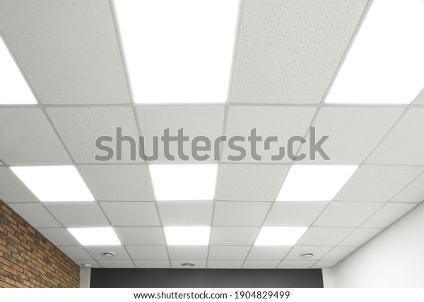 White ceiling with\
lighting in office room
