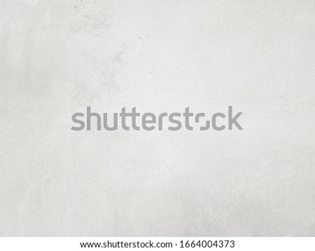 White cement wall background in vintage style for graphic design or wallpaper. Pattern of soft concrete floor in retro concept.