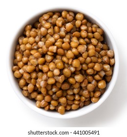 White Ceramic Bowl Of Brown Cooked Lentils Isolated On White From Above.