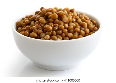 White Ceramic Bowl Of Brown Cooked Lentils Isolated On White In Perspective.