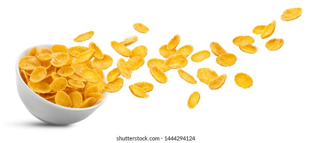 White ceramic bowl of dry uncooked corn flakes. Traditional breakfast yellow cereal in isolated porcelain plate. Falling cornflakes on white background