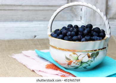 White ceramic bowl in form of basket with floral pattern full of fresh ripe sweet blueberry. Organic healthy food theme. Raw eating. - Powered by Shutterstock