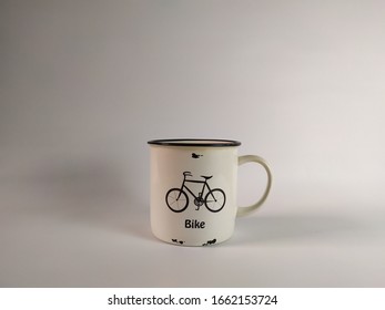 White ceramic cup with attractive bicycle pictures and white background - Powered by Shutterstock