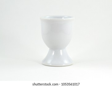 White ceramic egg cup without egg - isolated