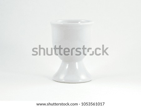 White ceramic egg cup without egg - isolated