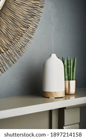 White ceramic electronic diffuser in a stylish interior