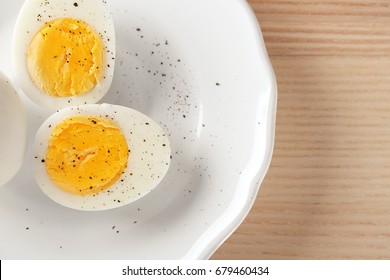 White ceramic plate with hard boiled eggs on table. Nutrition concept - Powered by Shutterstock