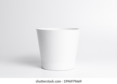 White Ceramic Pot With Porous Soil Mixture In Isolated White Background. 